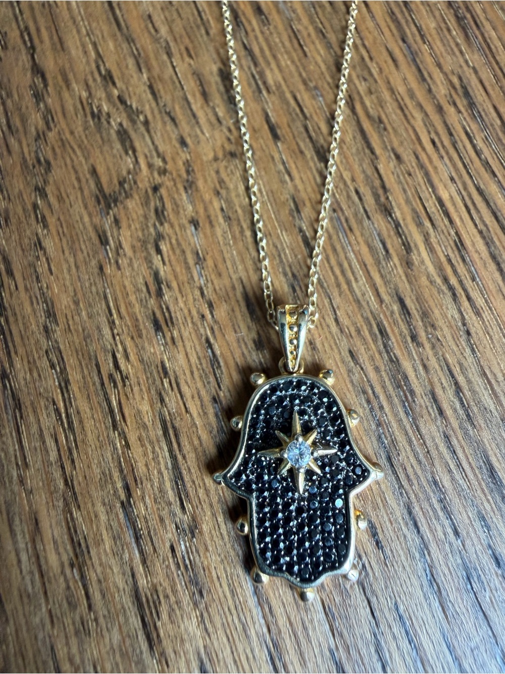 Gold Hamsa Pendant Necklace with Black Stone Pavé and Star Accent
